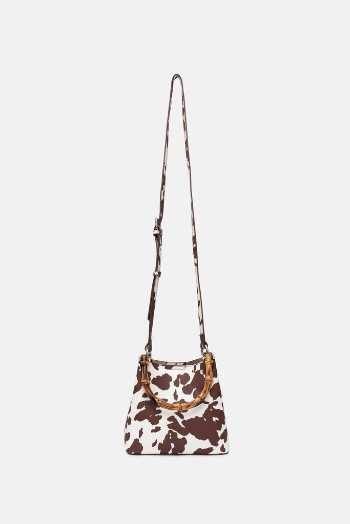 Jelavu Gracy Animal Print Bamboo Handle Bag in Cow Print