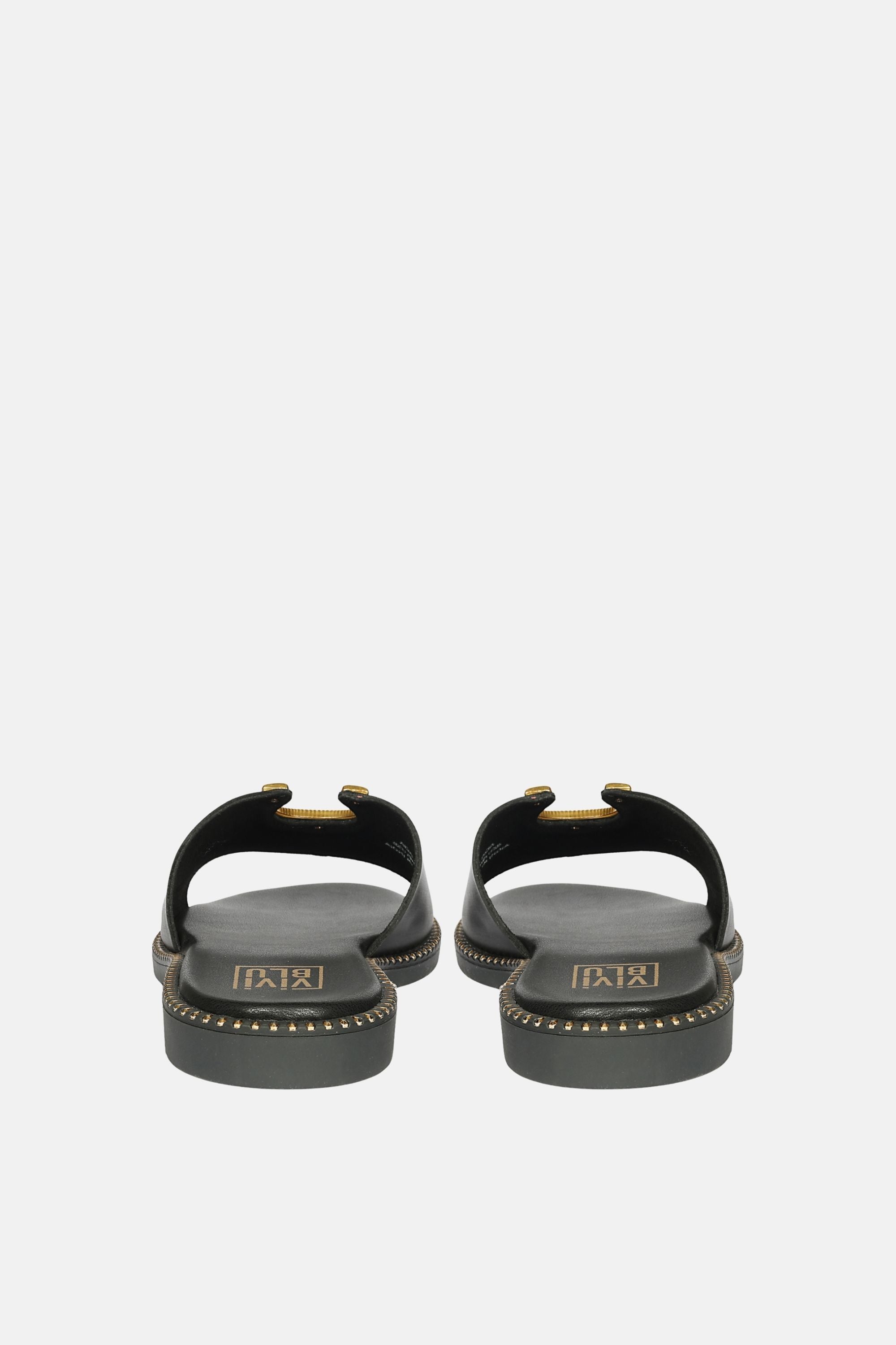 Lifestyle shot of Acacia Flats by Vivi Blu, highlighting versatility with dresses and jeans for day-to-night transitions.