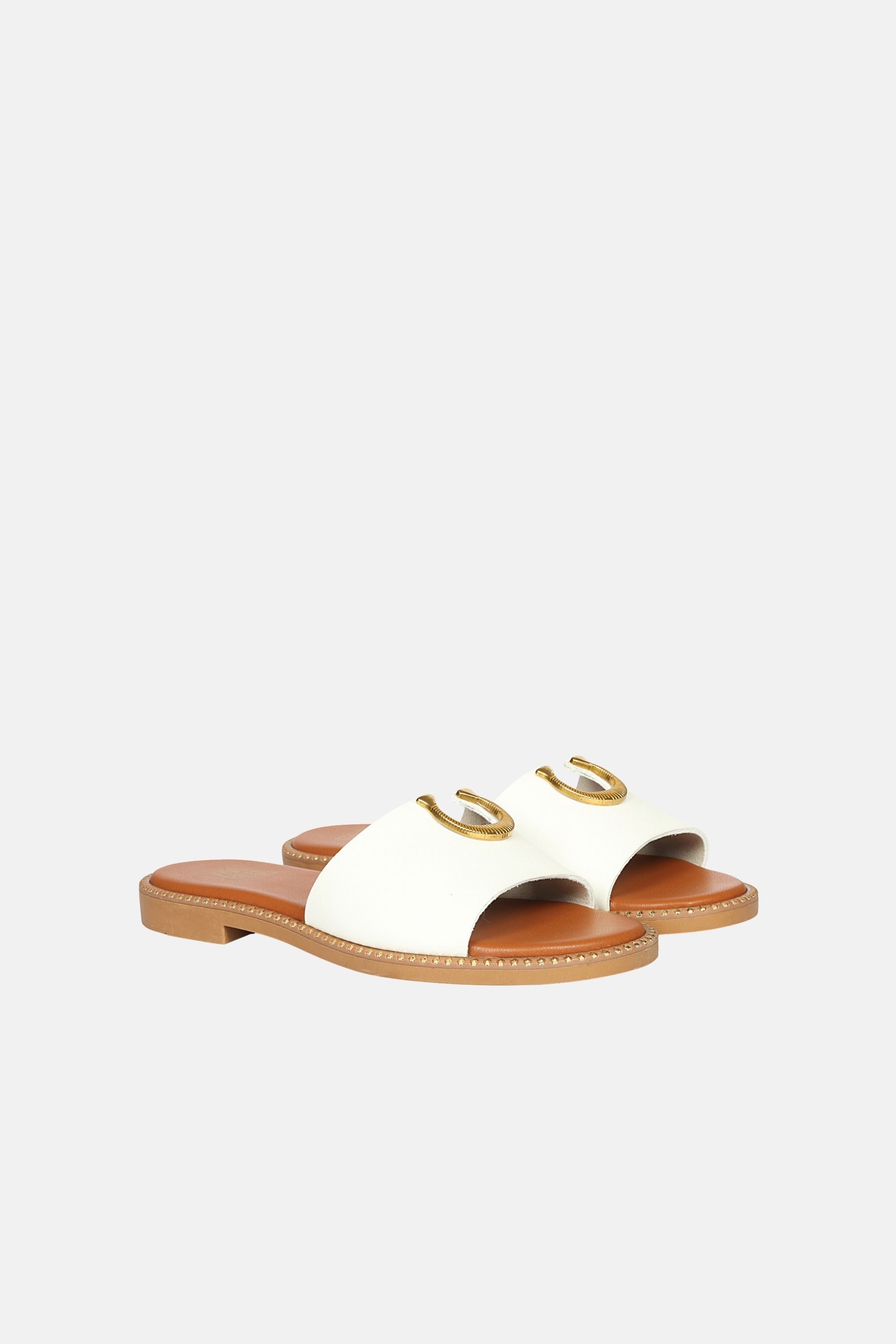 Acacia Flats laid out in a bright setting, highlighting their versatile slip-on style suited for any summer occasion.