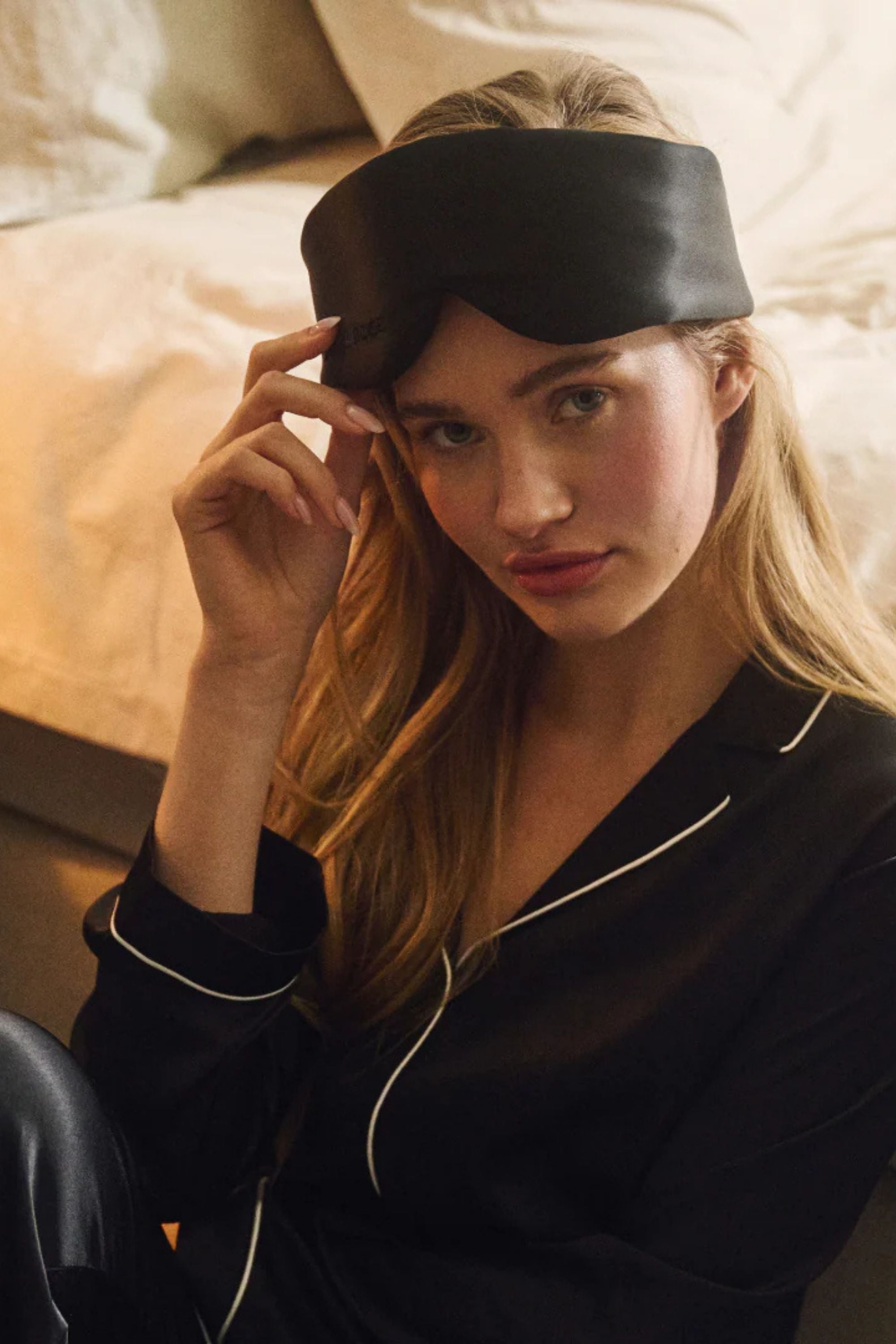 Close-up view of Dore & Rose Aura Mask Black highlighting its lightweight construction and luxurious texture, ideal for enhancing sleep and skincare.